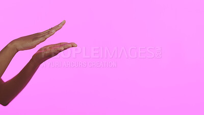 Buy stock photo Hands, beauty and mockup with a person on a pink background in studio for advertising or marketing. Skincare, banner and space with a model closeup on a color wall for a salon or spa treatment
