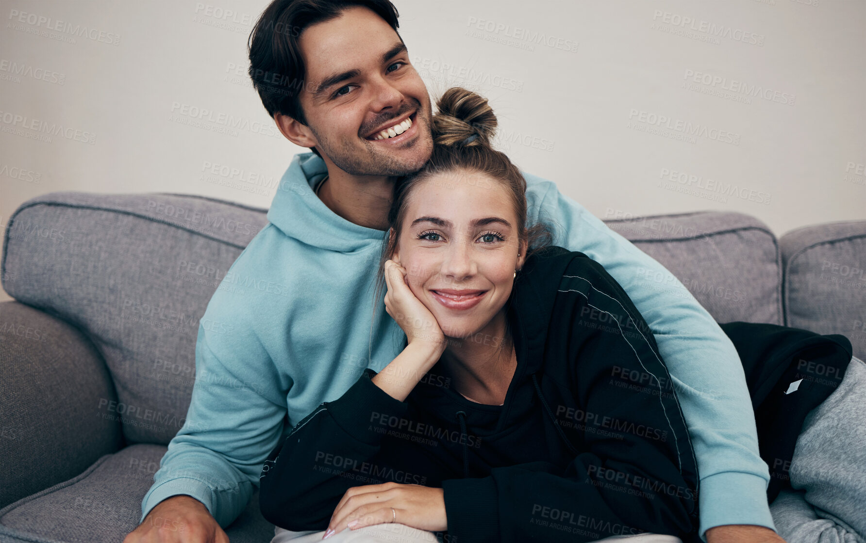 Buy stock photo Portrait, love and smile with a couple on a sofa in the living room of their home together for bonding. Relax, hug or date with a happy man and woman in their apartment for romance or relationship