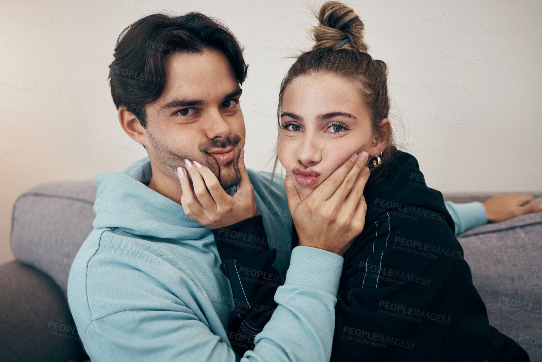 Buy stock photo Relax, cute and portrait of couple on sofa for bonding, healthy relationship and love in living room. Dating, happy and man and woman holding face for silly, goofy and playful fun at home together