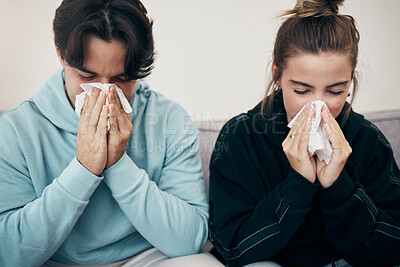 Buy stock photo Couple, sick and couch with tissue, sickness and virus for infection, sinus and cold symptoms. Sneeze, blowing nose and allergy in living room sofa, hayfever and healthcare for disease, man and woman