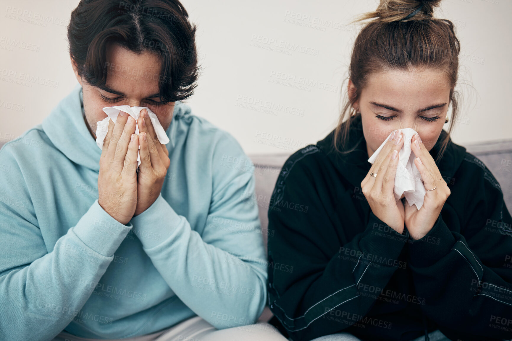 Buy stock photo Couple, sick and couch with tissue, sickness and virus for infection, sinus and cold symptoms. Sneeze, blowing nose and allergy in living room sofa, hayfever and healthcare for disease, man and woman