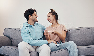 Buy stock photo Pregnancy test, happy and couple in home living room, reading good news or check results. Kit, excited man and pregnant woman or mother smile on sofa for success, future maternity or ivf fertility