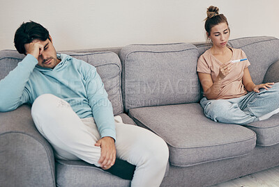 Buy stock photo Pregnancy test, stress and couple on a sofa angry, fighting or argue in their home. Pregnant, conflict and frustrated people in a living room upset with infertility criss, loss or ivf treatment fail