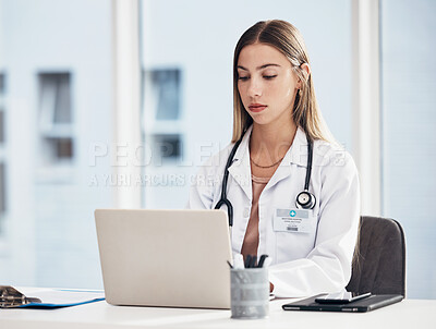 Buy stock photo Doctor, woman and laptop for hospital research, medical study and planning for telehealth or clinic report. Healthcare worker or student working on computer for website information, review or service