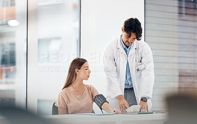Buy stock photo Doctor, woman and blood pressure machine for hypertension, health assessment or check up at hospital. Healthcare, professional or person with monitor, digital equipment or exam for wellness at clinic