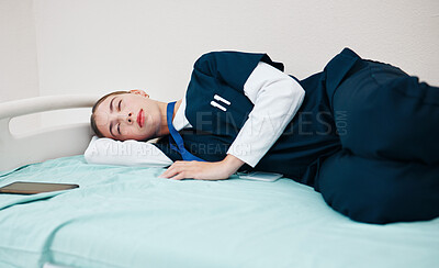 Buy stock photo Sleeping, hospital and tired nurse for rest, nap and break for burnout, exhausted and fatigue. Healthcare, clinic and woman relax for medical service, wellness and stress on bed for night shift