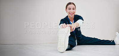Buy stock photo Portrait, space and a nurse stretching on the floor of a studio, getting ready for healthcare or medical treatment. Smile, warm up and a happy young volunteer or medicine professional on mockup