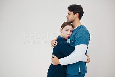 Buy stock photo Doctor, colleagues and tired fatigue or support at healthcare clinic, work stress or hug. Medical professionals, friends or helping comfort in scrubs on wall background, mockup or burnout at hospital