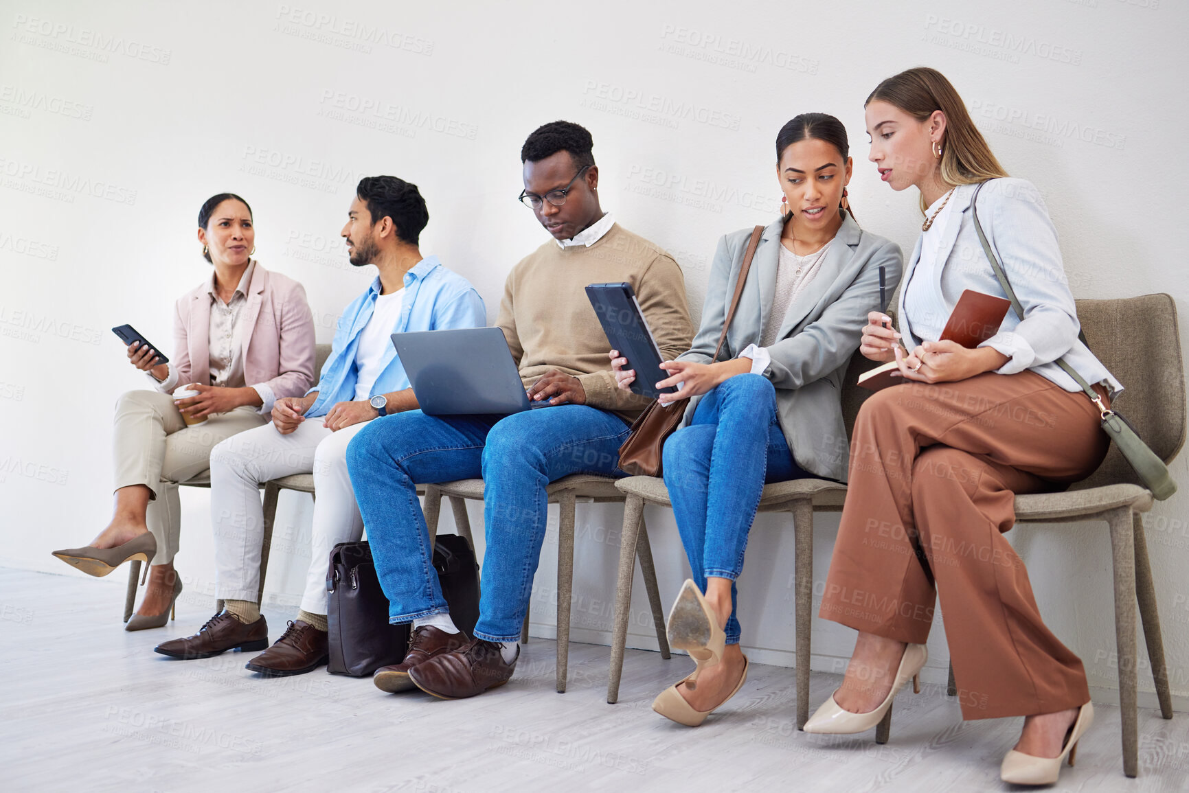 Buy stock photo Creative people, technology and waiting room at office in row, networking or sitting for recruiting at office. Group of employees or team startup in line for hiring, teamwork or meeting at workplace