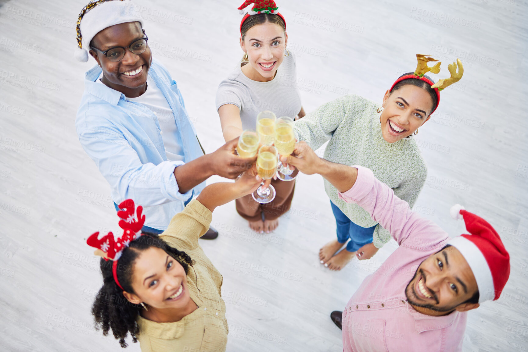 Buy stock photo Portrait, toast and a business team at a Christmas office party together for celebration event from above. Diversity, happy or champagne with an employee group of men and woman in the workplace