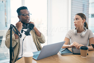 Buy stock photo Man, podcast team and streaming live or online recording, creative conversation or microphone. Black male person, woman or laptop office for social network, influencer audience or content creating