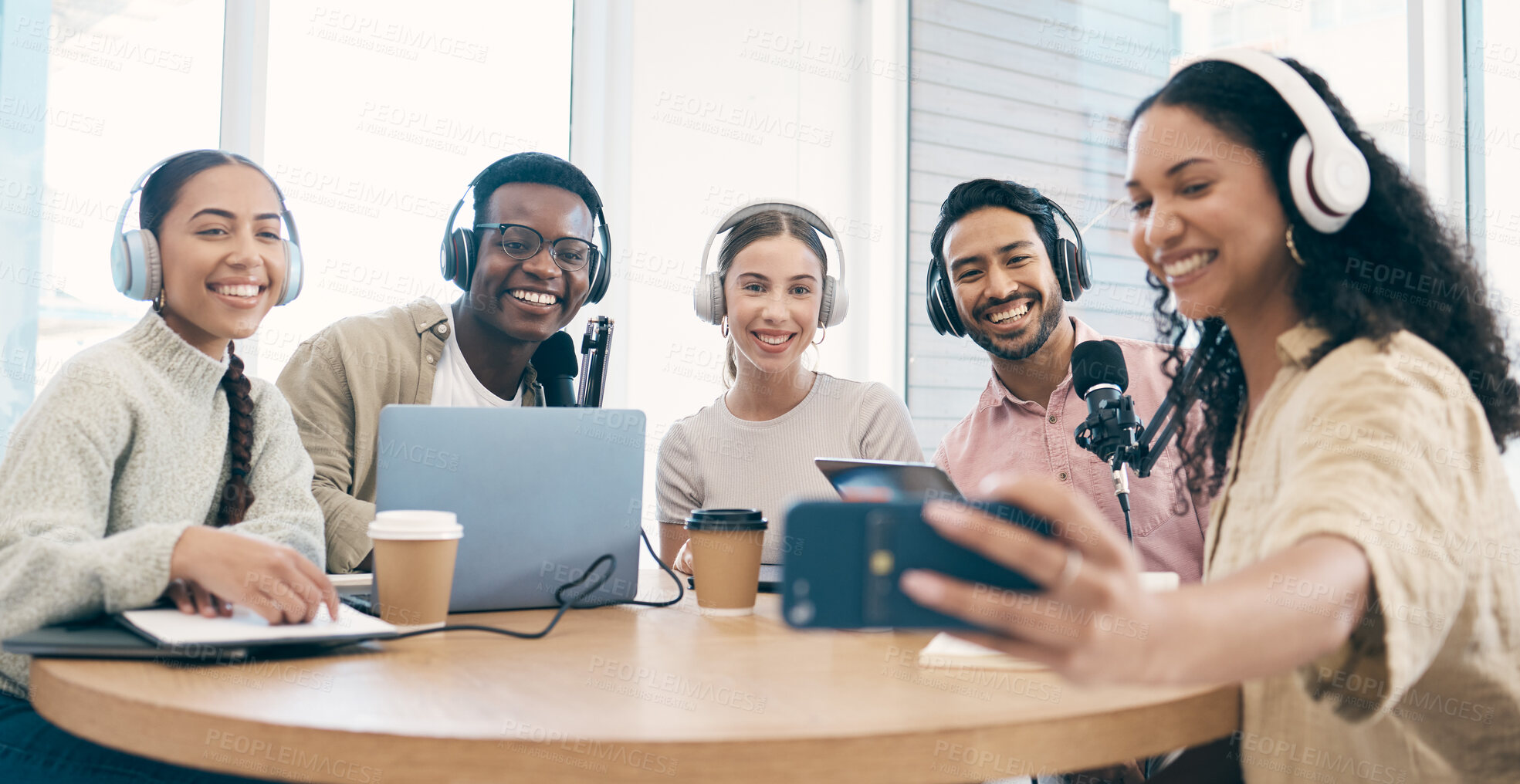 Buy stock photo Podcast, smile and group selfie of friends together bonding, live streaming and people recording broadcast in studio. Happy team of radio hosts take picture at table for social media or collaboration