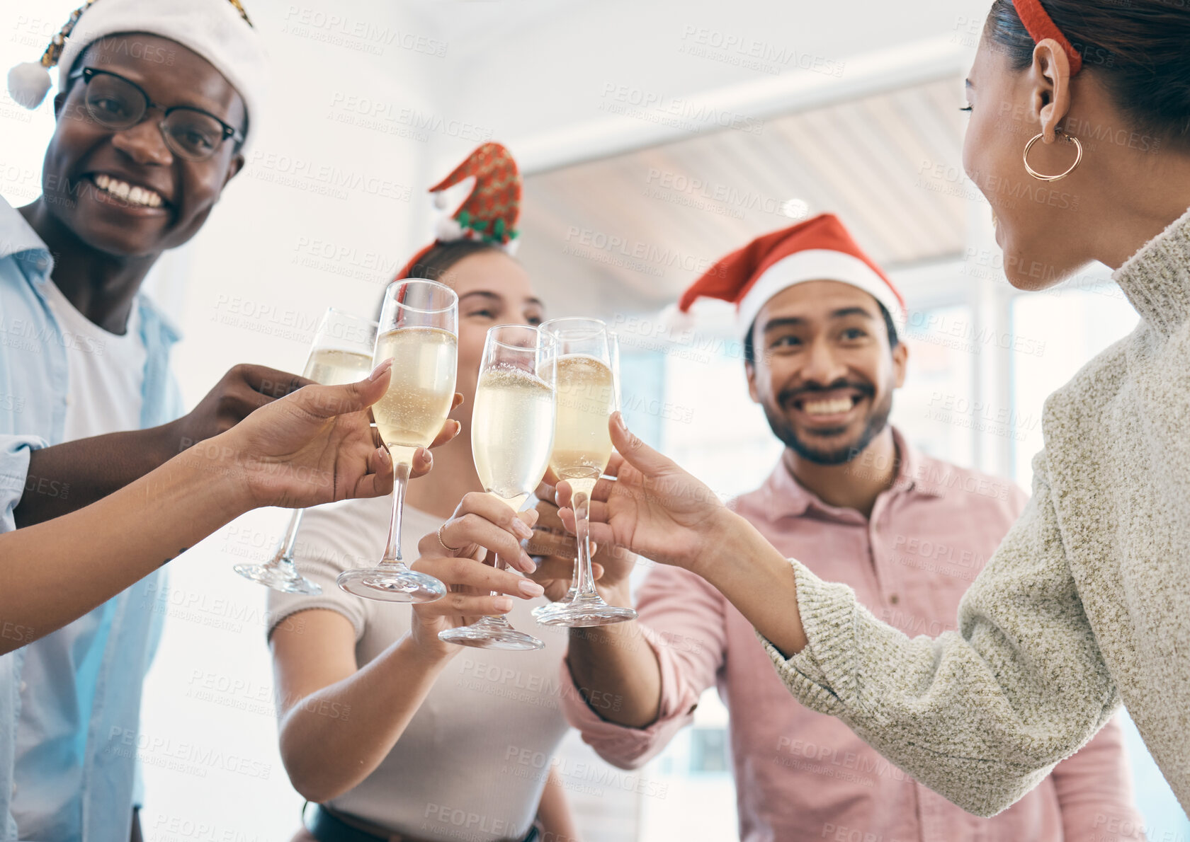 Buy stock photo Champagne, Christmas party and toast with people at office, group celebration and fun with holiday and alcohol. Wine, cheers and employees at work event for Xmas, happy and diversity with drinks