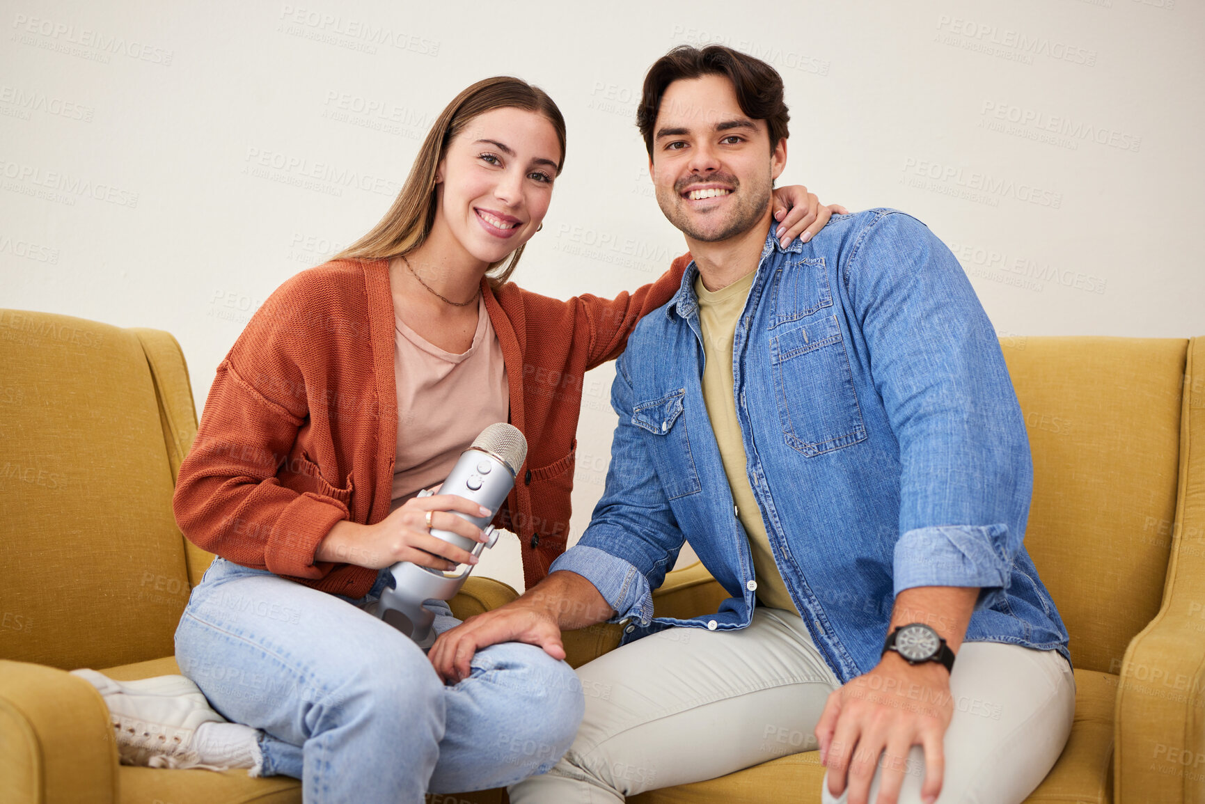 Buy stock photo Portrait, microphone and podcast with a couple on a sofa in the living room of their home together. Smile, radio or talkshow with a happy young man and woman in their house for live streaming