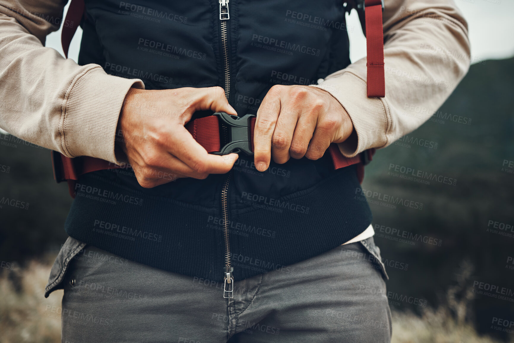 Buy stock photo Closeup hands, man and nature fastening a backpack for hiking, trekking or travel in the mountains. Walking, buckle clip and a tourist with a bag in the woods for activity, fitness and exercise