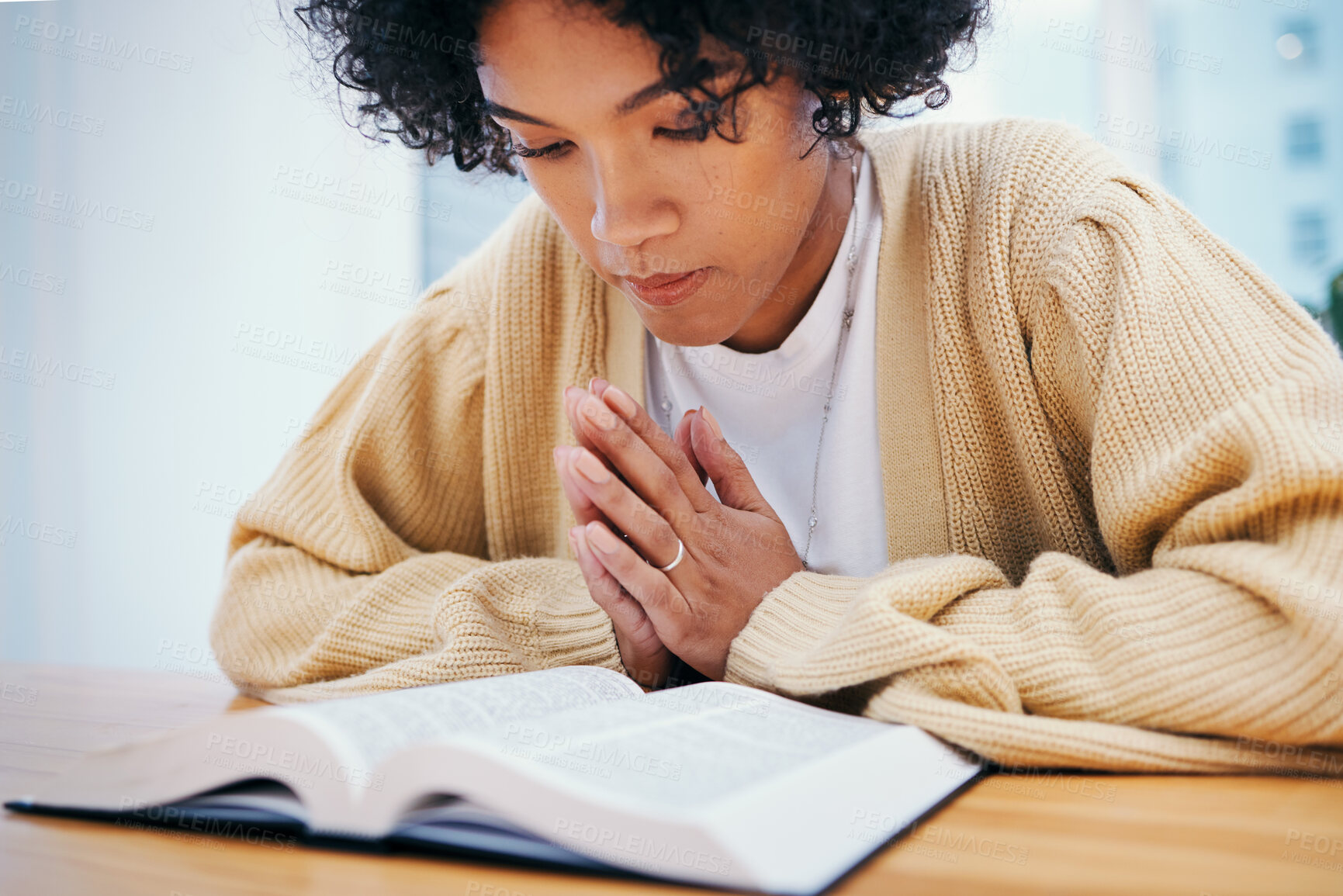 Buy stock photo Woman, bible and prayer at desk, religion and Christian worship in home at table. Person, holy book and meditation for God, Jesus Christ and studying for faith in spiritual gospel, praise or reading