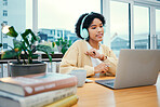 Headphones, dance and young woman with laptop in living room listening to music, playlist or album. Smile, technology and female person from Colombia moving and streaming song on radio with computer.