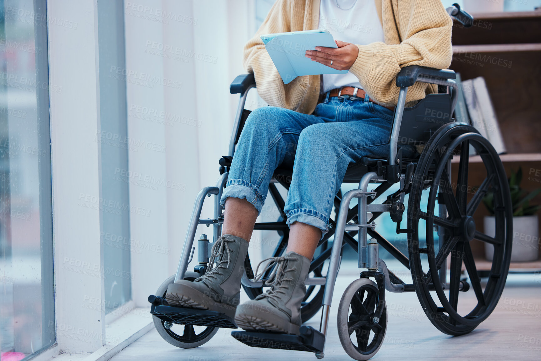 Buy stock photo Inclusion, tablet and a person in a wheelchair at the office for communication, planning or the internet. Sitting, online and an employee with a disability, typing and technology for digital work