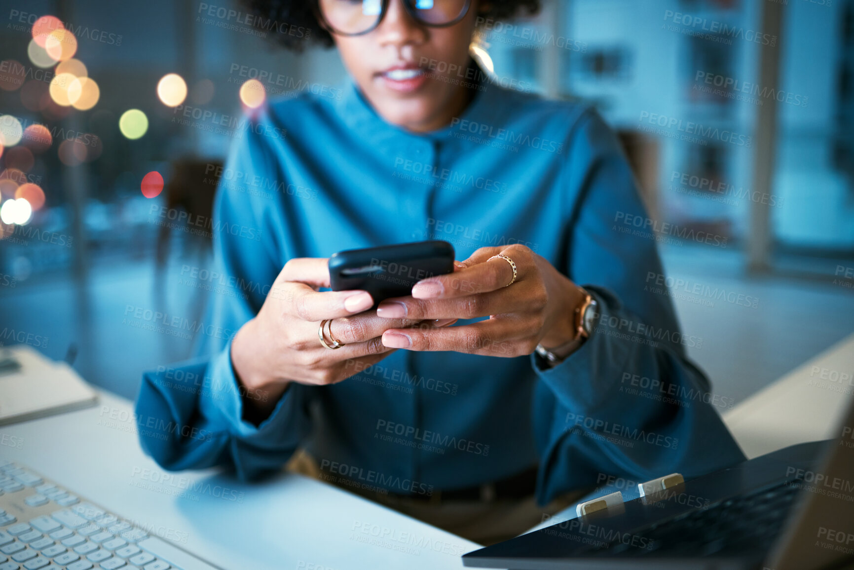 Buy stock photo Night, phone and hands of business woman in office with social media, text or chat communication. Working late, message and female entrepreneur with smartphone app for internet, search or reading 