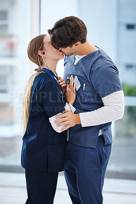 Buy stock photo Couple, hospital and doctors kiss for romance, work relationship and love in clinic. Healthcare team, collaboration and happy man and woman embrace in medical service, support and medicare career