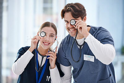 Buy stock photo Portrait, healthcare and stethoscope with nurse friends having fun in the hospital together for cardiology. Smile, funny or comedy with a man and woman medicine professional in a medical clinic