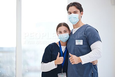 Buy stock photo Portrait, doctors and people hug, thumbs up or vote opinion for medical support, service agreement or job well done. Safety face mask, emoji like sign and surgeon team embrace, trust and yes feedback