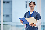 Hospital portrait, doctor folder and happy man with results, healthcare records or clinic info data. Happiness, medical research or professional nurse smile for medicine, wellness or health portfolio