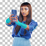 Fashion, selfie and woman with smartphone and cyberpunk neon clothing isolated on blue background. Social media, future and trendy gen z influencer from India with phone in studio for profile picture