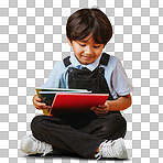 One cute little asian boy sitting on the floor wearing casual clothes while reading against an orange background. Happy and content while focused on education. Child ready for school