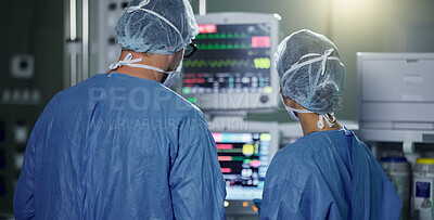 Buy stock photo Teamwork, screen monitor or surgeon in surgery procedure or healthcare operation in hospital. Night, back view or doctors in face mask working or helping in dark operating room in medical clinic 