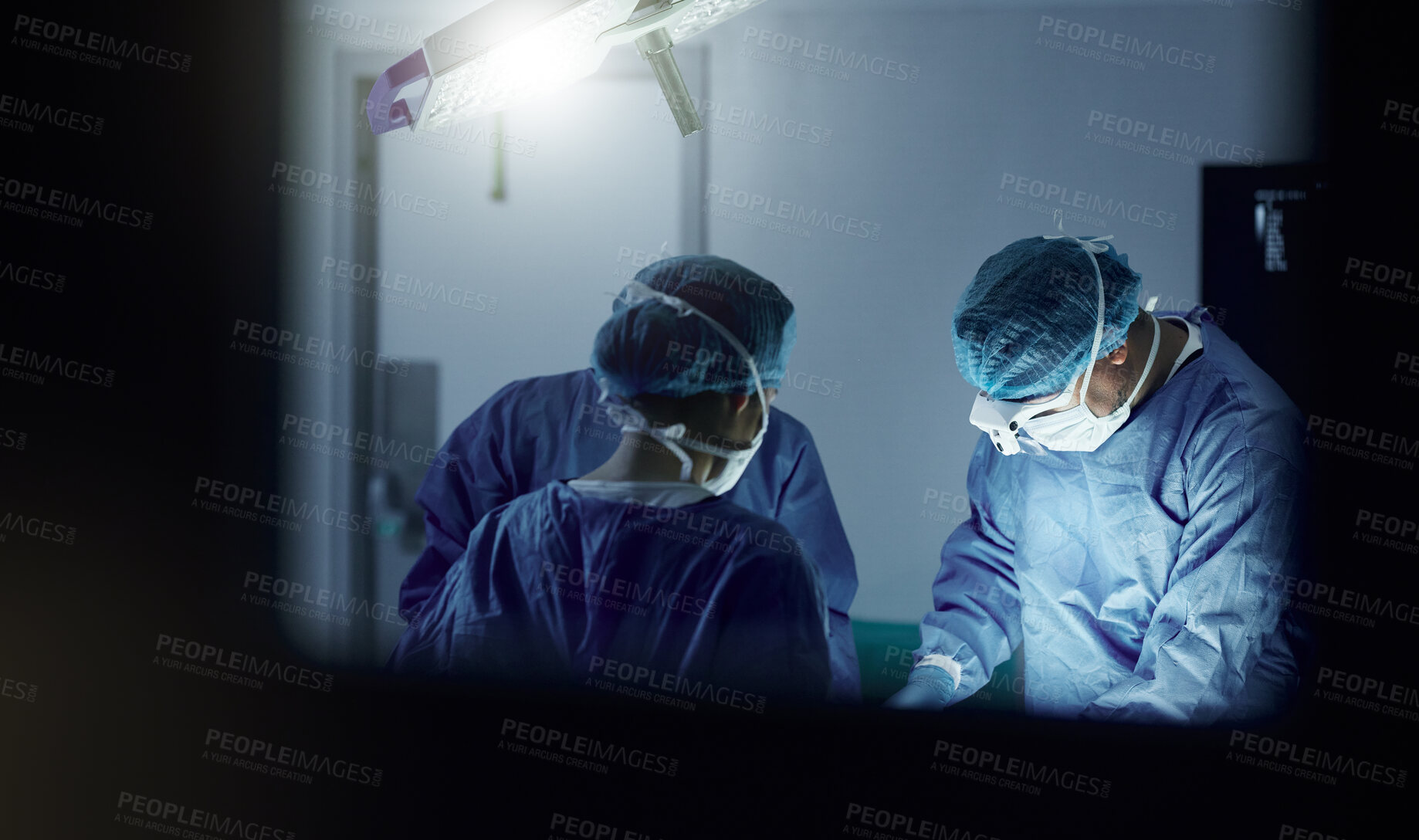 Buy stock photo Teamwork, emergency and doctors in a hospital for surgery together, working in theater to save a life. Medical, healthcare and a surgeon team in the operating room of a clinic for an operation