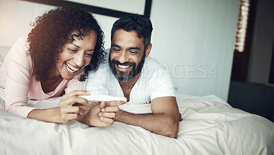 Buy stock photo Couple, happy and bedroom with pregnancy test, positive and bed with smile, results and excited. Man, woman and baby with stick, love and maternity for future family, surprise and pregnant together