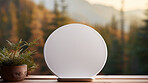 A white round empty plate on table against background. Copy space concept.