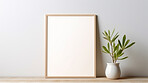 Canvas mockup against white wall. Empty canvas on table top for your design.