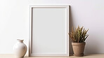 Canvas mockup against white wall. Empty canvas on table top for your design.