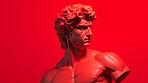 Sculpture or statue of David with angry or annoyed expression on red background