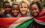 Group of diverse kids holding a flag. Educate and celebrate different nationalities and countries