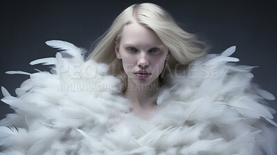 Woman in white feather dress. Creative art and fashion concept