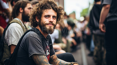 Street style portrait of smiling tattooed man in street. Alternative lifestyle concept.