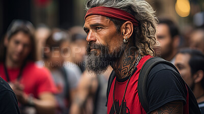 Portrait of senior, tattooed man in street. Alternative lifestyle concept.