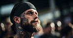 Portrait of attractive tattooed model in street. Alternative lifestyle concept.