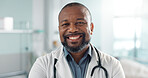 Healthcare, doctor and face of black man at hospital with smile for support, service and wellness. Medicine, professional and African expert with happiness and pride for career, surgery or insurance