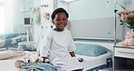 Sick African boy child, hospital and bed with face, smile and rest for recovery from surgery, treatment or healthcare. Patient kid, happy and portrait to relax, sitting and clinic for rehabilitation