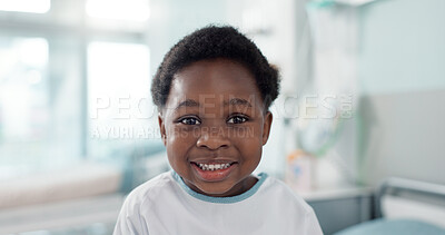 Face, smile and a boy child patient in the hospital to visit a pediatrician for healthcare or a medical checkup. Portrait, medicine and a happy young african kid in a clinic for treatment or cure
