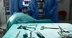 Surgery, health and tools in operation theatre, help in medicine with treatment and closeup of equipment on table. Metal, medical and surgical instrument with doctor people at hospital for healthcare