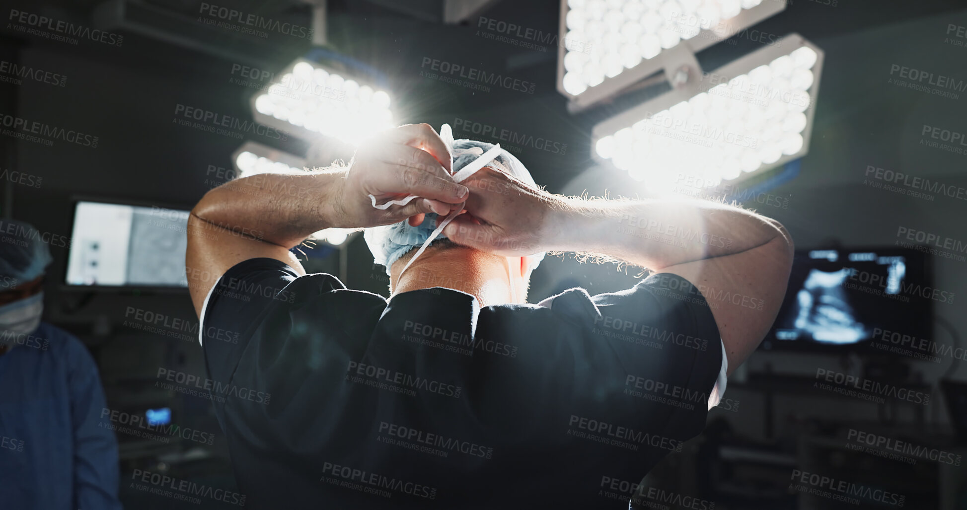 Buy stock photo Surgery, prepare and doctor tie mask in operating room for medical service, protection and operation. Healthcare team, safety scrubs and person with uniform for emergency, procedure and wellness