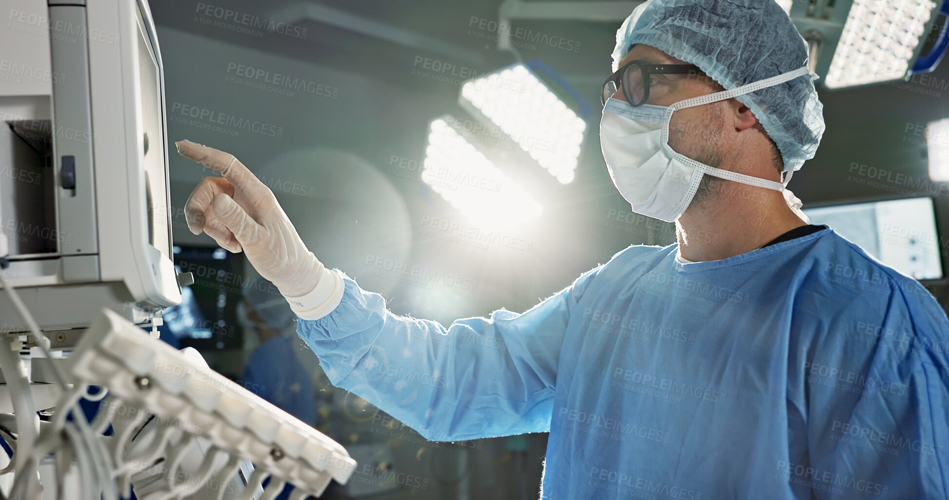 Buy stock photo Team, surgeon and press monitor in hospital, clinic and operation theater. ECG, doctor and medical professional on tech for heart rate monitor, cardiology and man on electrocardiogram on lens flare