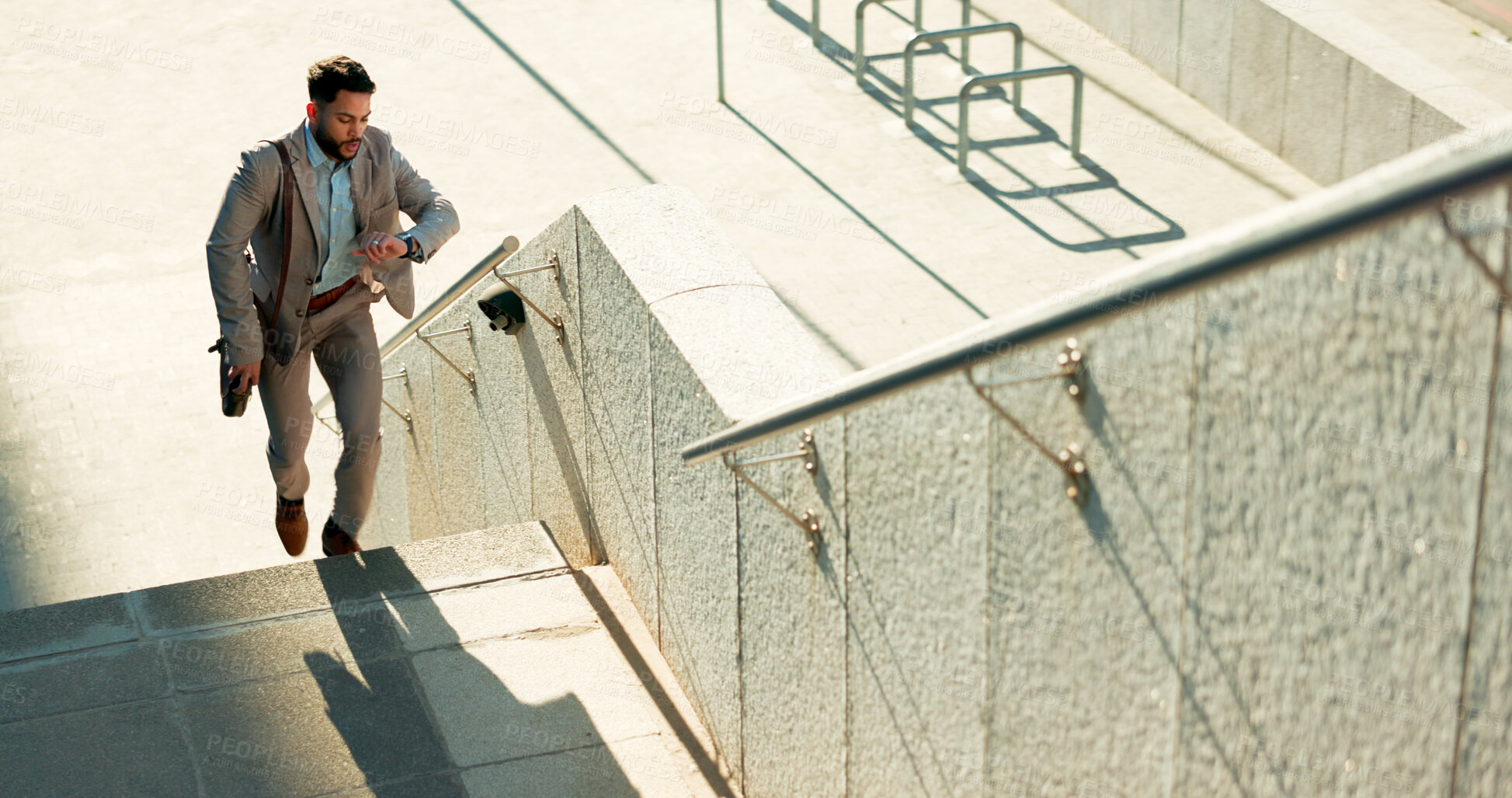 Buy stock photo Business, city and man on the stairs, late and running with appointment, schedule and stress. Person outdoor, professional or employee check time, steps or travel with worker, rush or speed to office