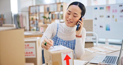 Ecommerce, woman with phone call and boxes, writing and checking sales and work at Japanese fashion startup. Online shopping, package and small business owner with smartphone, orders and networking.