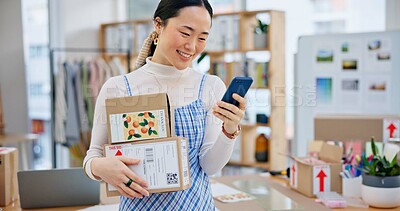 Buy stock photo Package, startup and Asian woman with phone for business at a fashion retail boutique. Networking, technology and young female entrepreneur with cardboard boxes and cellphone for delivery information